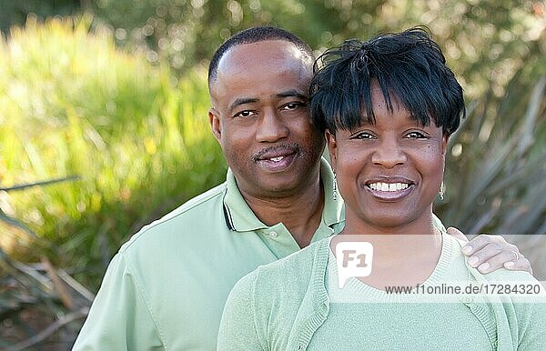 Attractive and affectionate african american couple posing in the park