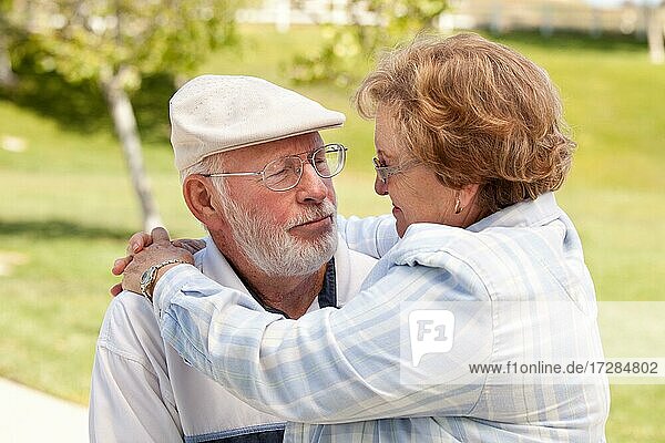 Happy senior couple enjoying each other in the park