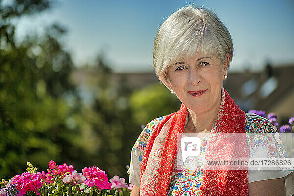 Senior woman wearing scarf on sunny day