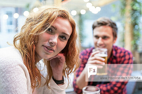 Young woman with boyfriend at pub