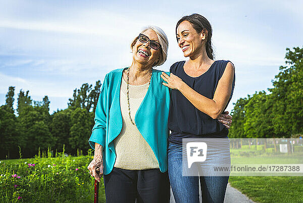 Happy women walking together at park