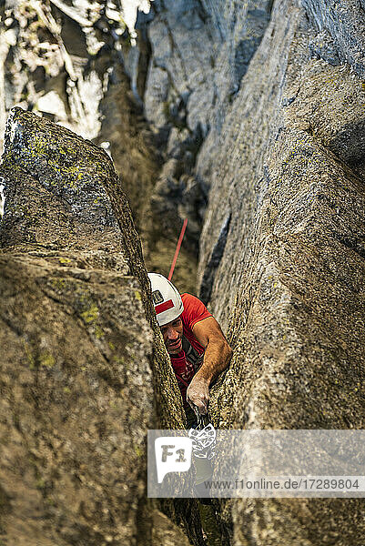 Man climbing on rock mountain
