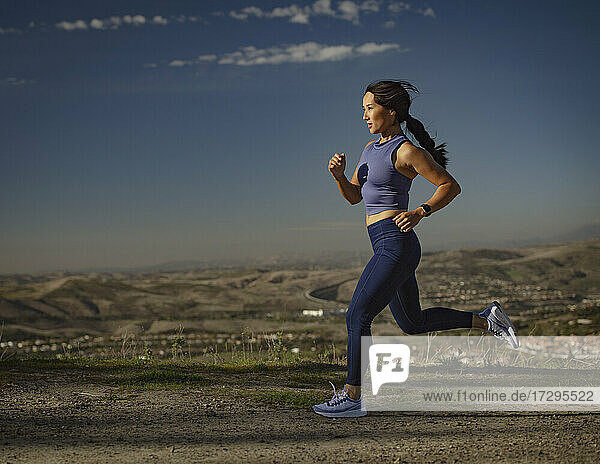 Woman jogging in landscape