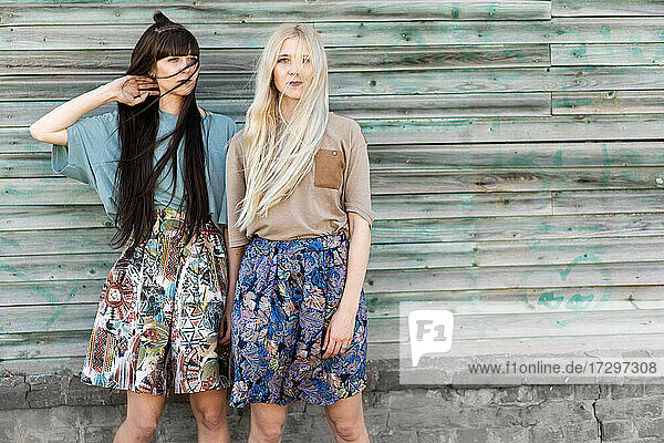fashion girls twins posing in the street