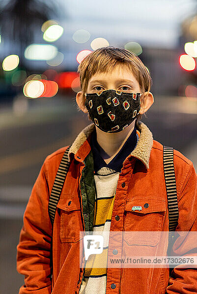 Portrait of teenager wearing mask during COVID 19 pandemic in city