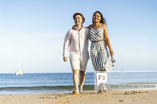 Young couple enjoying time together on the beach in Algarve  Portugal  Europe