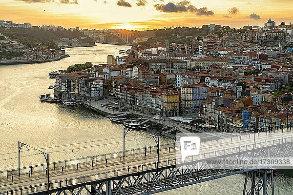 Skyline of the historic city of Porto with famous bridge by sunset  Portugal  Europe