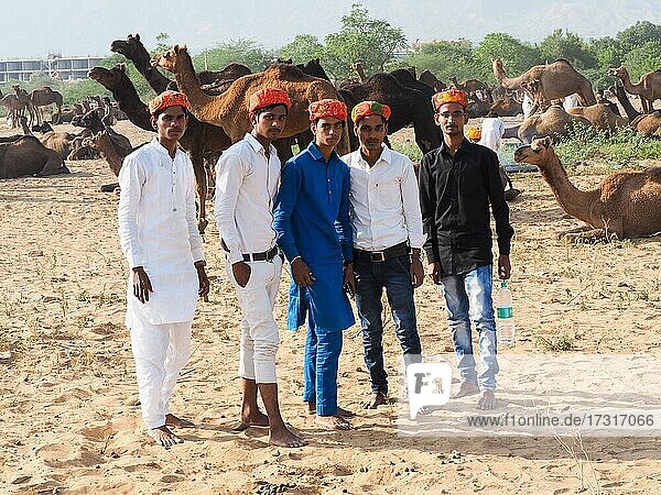 A group of young men at the camel market of Pushkar  Rajasthan  India  Asia