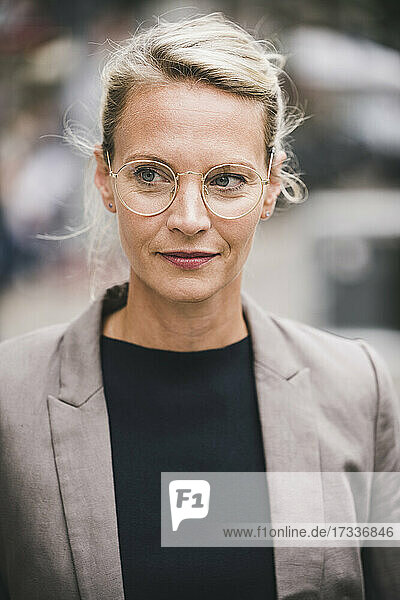 Blond businesswoman wearing eyeglasses