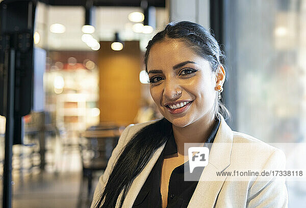 Smiling businesswoman at coffee shop
