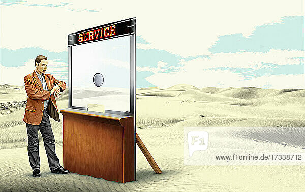 Mann wartet am verlassenen Serviceschalter in der Wüste