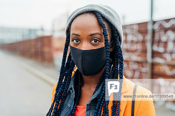 Italy  Milan  Portrait of woman in face mask on street