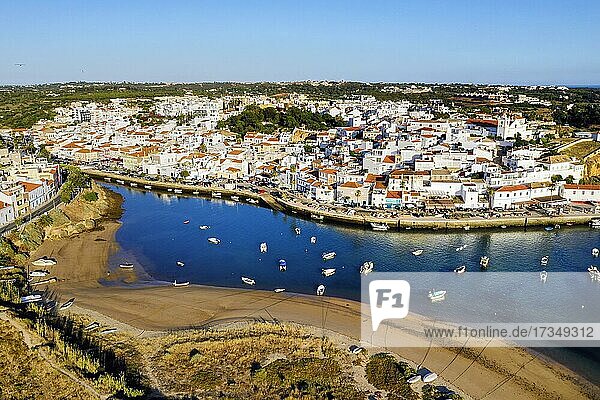 Aerial cityscape of white washed Ferragudo by Arade River  Algarve  Portugal  Europe