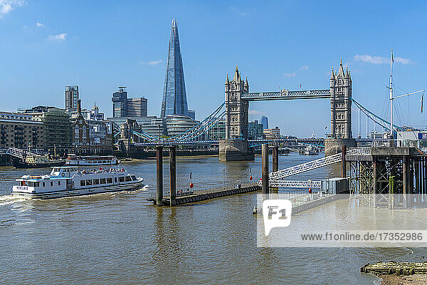 View of Tower Bridge and The Shard with tour boat on the River Thames  London  England  United Kingdom  Europe