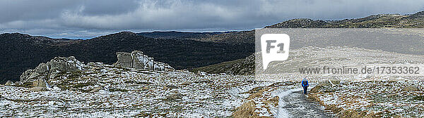 Australia  New South Wales  Snowy Mountains National Park  Woman hiking on snowy trail at Charlotte Pass in Kosciuszko National Park