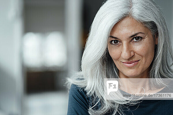 Businesswoman with white hair at office