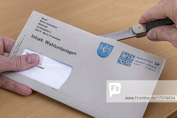 Man opens envelope with postal voting documents for the election of members of the German Bundestag on 26.09.2021  Germany  Europe