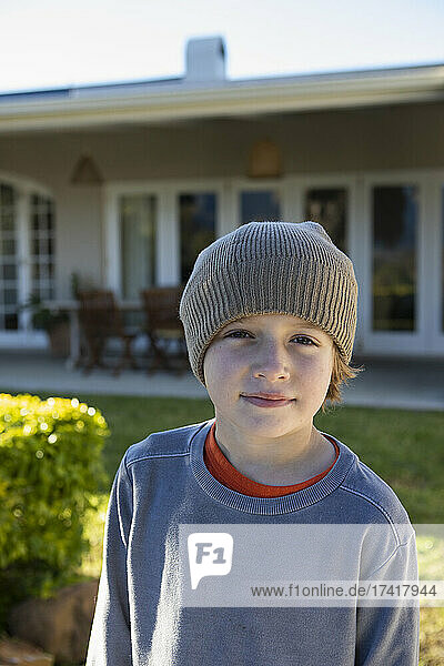 Portrait of a boy wearing a woolly hat.