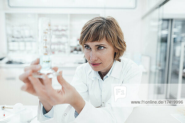 Female pharmacist analyzing at laboratory