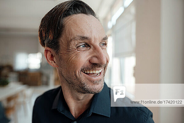 Happy mature male professional with wrinkles on face