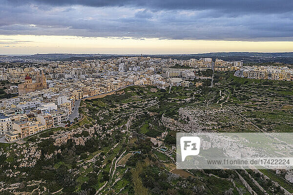 Malta  Northern Region  Mellieha  Aerial view of storm clouds over town surrounding small valley