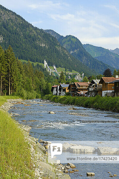 Germany  Bavaria  Oberstdorf  Trettach river flowing past mountain town in summer