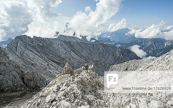 Hiker in a boulder field  hiking to the Hochkalter  Berchtesgaden Alps  Berchtesgadener Land  Upper Bavaria  Bavaria  Germany  Europe
