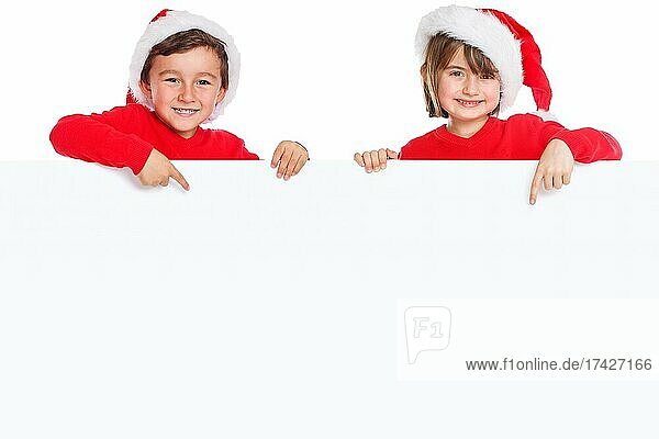 Weihnachten Kinder Weihnachtsmann Nikolaus lachen zeigen Schild Freisteller Textfreiraum Copyspace jung  Deutschland  Europa