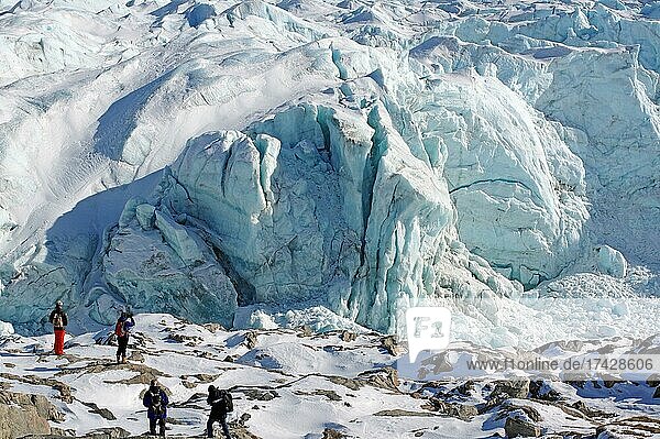 People in front of crevasses and ice front of a glacier  Russell Glacier  Kangerlussuaq  Greenland  Denmark  North America