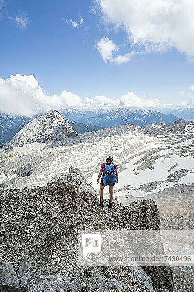 Hiker on the via ferrata to the Patenkirchner Dreitorspitze  Wetterstein Mountains  Garmisch-Partenkirchen  Bavaria  Germany  Europe