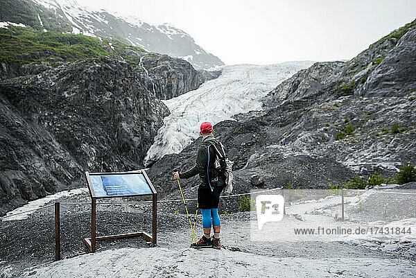 USA  Alaska  Rear view of hiker looking at glacier in Denali National Park