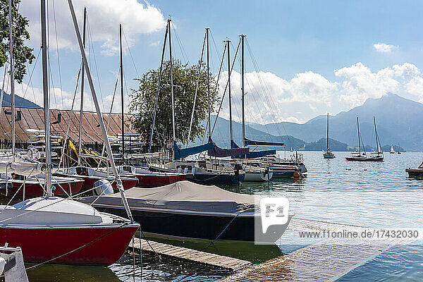 Austria  Boats moored at pier on Mondsee