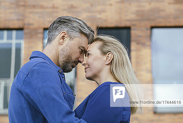 Blond woman and man looking at each other