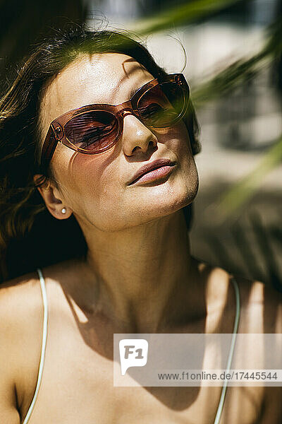 Beautiful woman wearing sunglasses during sunny day