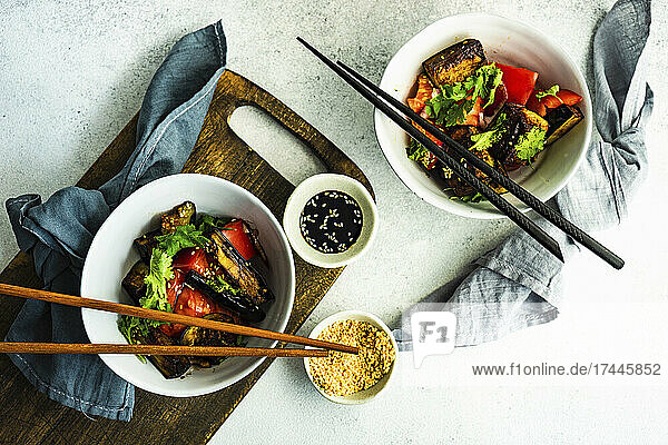 Fresh Asian style vegetable salad with fried eggplant and soy sauce