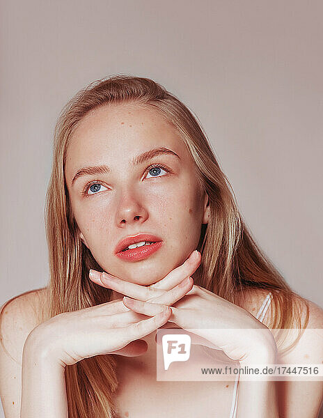 Blonde woman natural hair beauty closeup portrait