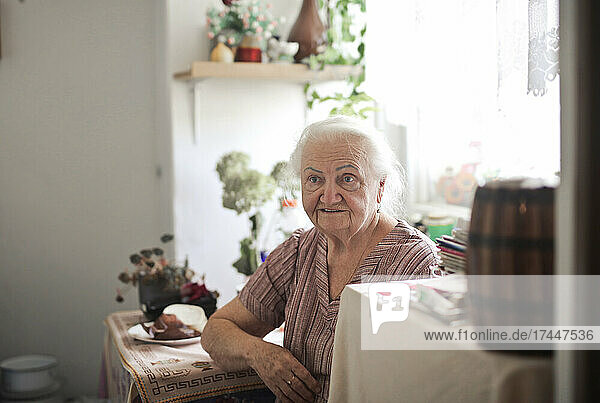 portrait of elderly lady in her kitchen