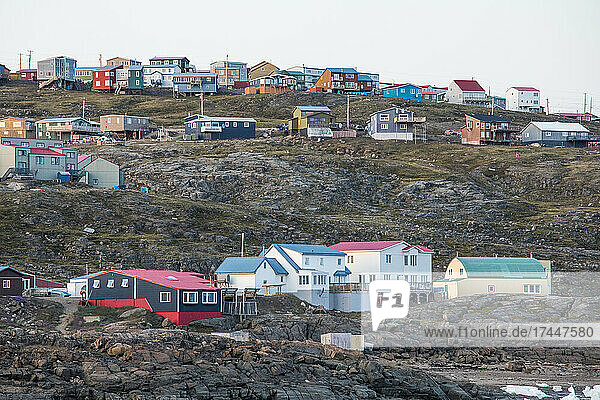 Homes built on seaside cliffs  Iqaluit  Baffin Island.