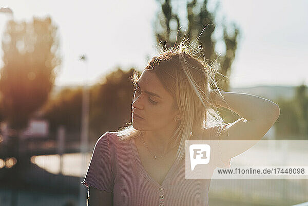 Portrait of a blonde girl enjoying the sunset.