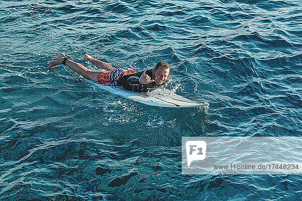 Surfer in Indian Ocean  Maldives