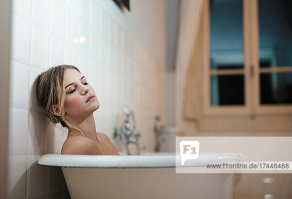 young woman relaxed in bathtub