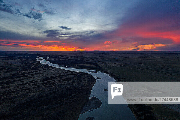 Neon Red Sunset Over Red Deer River