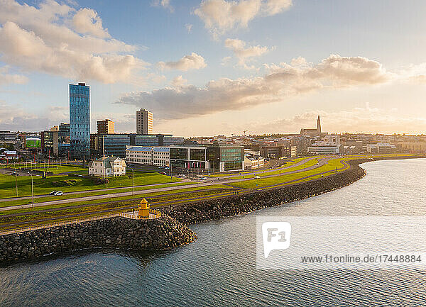 Lighthouse and Reykjavik city in the afternoon sun.
