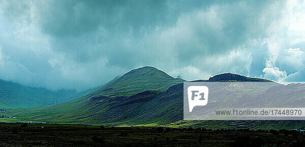 Heavy clouds and mountain landscape in Iceland.