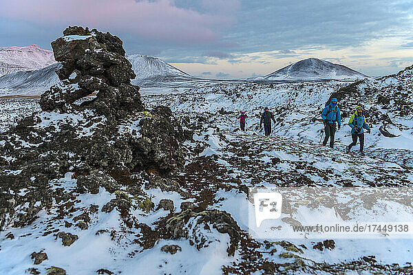 people hiking through the frozen landscape in the west of Iceland