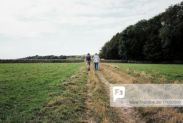 older couple walking together in the countryside