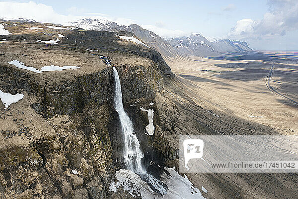 Bjarnarfoss waterfall from aerial view in winter