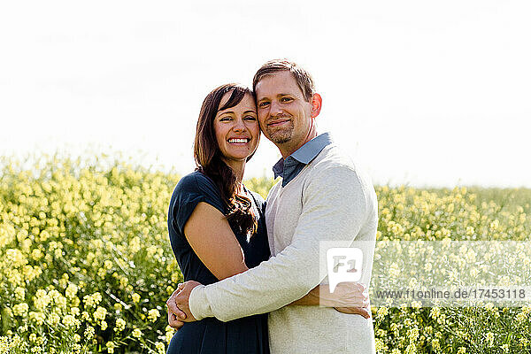 Husband & Wife Posing in Wildflower Field in San Diego