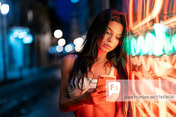 Woman near to neon light