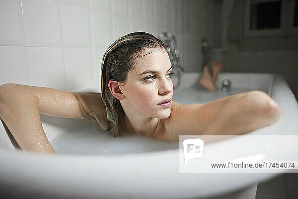 portrait of ayoung beautiful woman in a bathtub